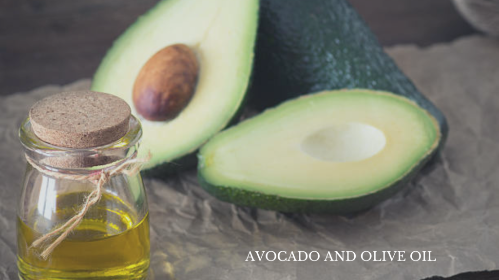 Frizzy Hair- Close-up of a bottle of avocado essential oil alongside a fresh avocado fruit