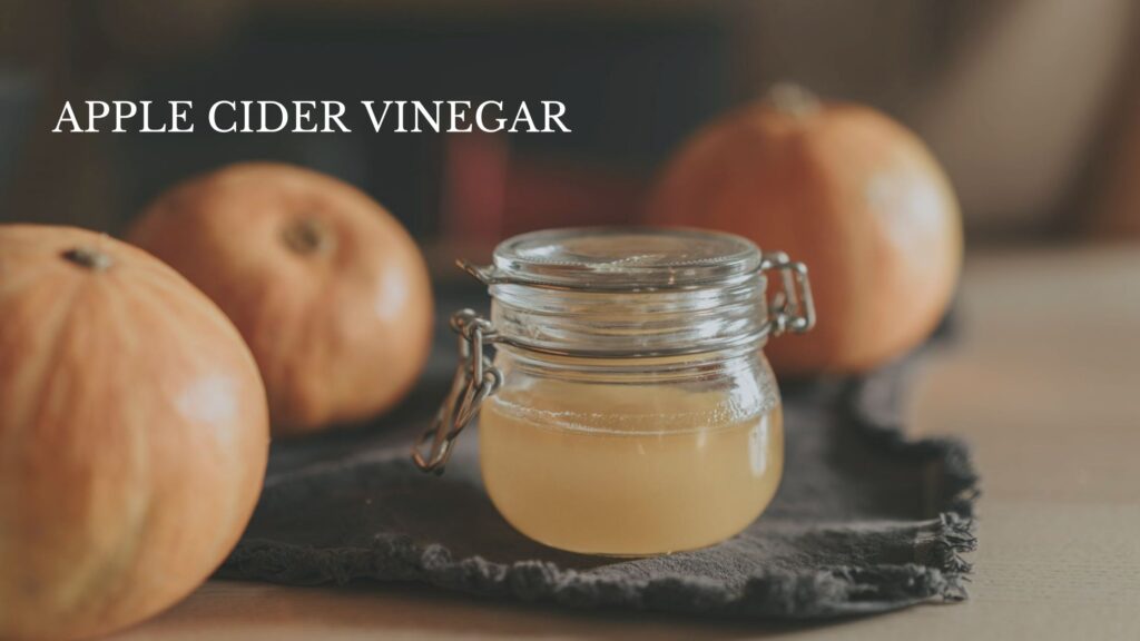 Clear glass jar filled with apple cider vinegar on display for teeth whitening