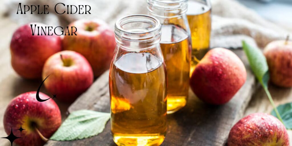 Image of apple cider vinegar, a popular natural treatment for acne, shown with fresh apples in background