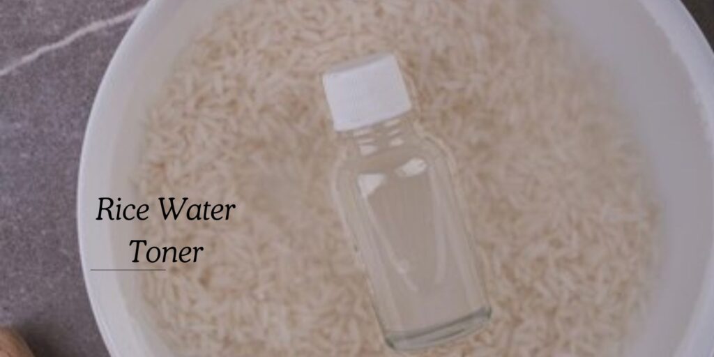 A bottle of **rice water toner** over soaking rice, a natural remedy for clear skin